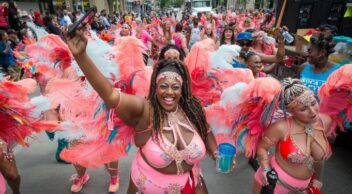 Cariwest Festival ladies dancing on Jasper Avenue parade